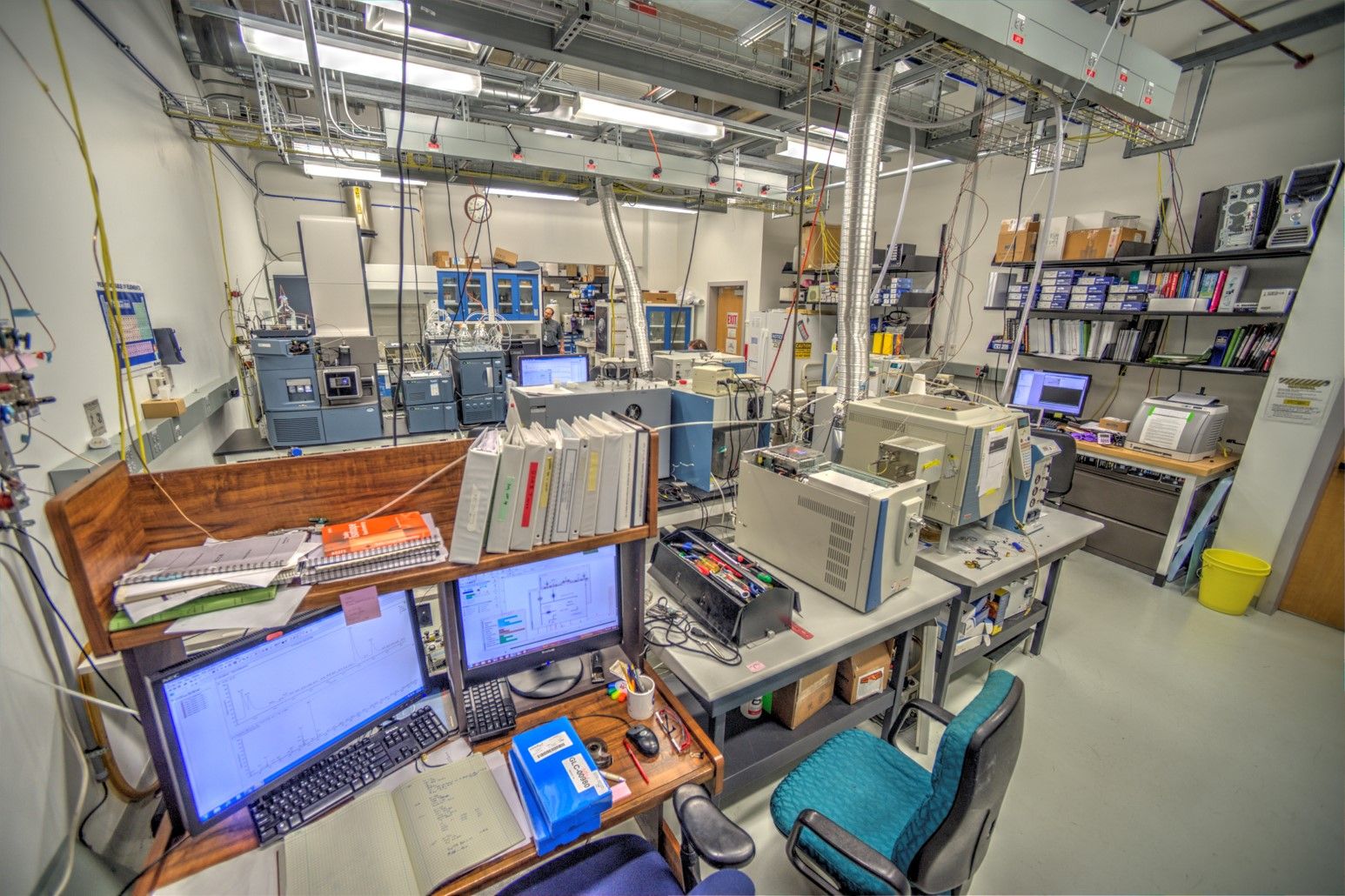 Computers and machinery sitting on lab benches.