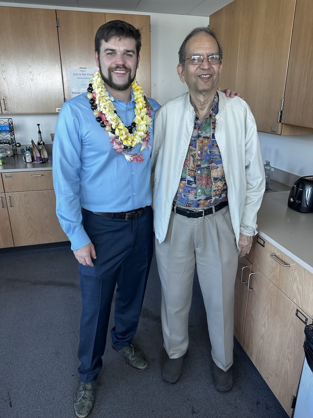 Evan Kelly beside his advisor Shiv Sharma at the University of Hawaii at Manoa's Hawaii Institute for Geophysics and Planetology. Taken directly after defending his dissertation.